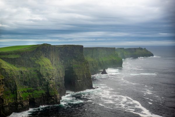 A beautiful view of the cliffs of Moher in Ireland on a gloomy day background