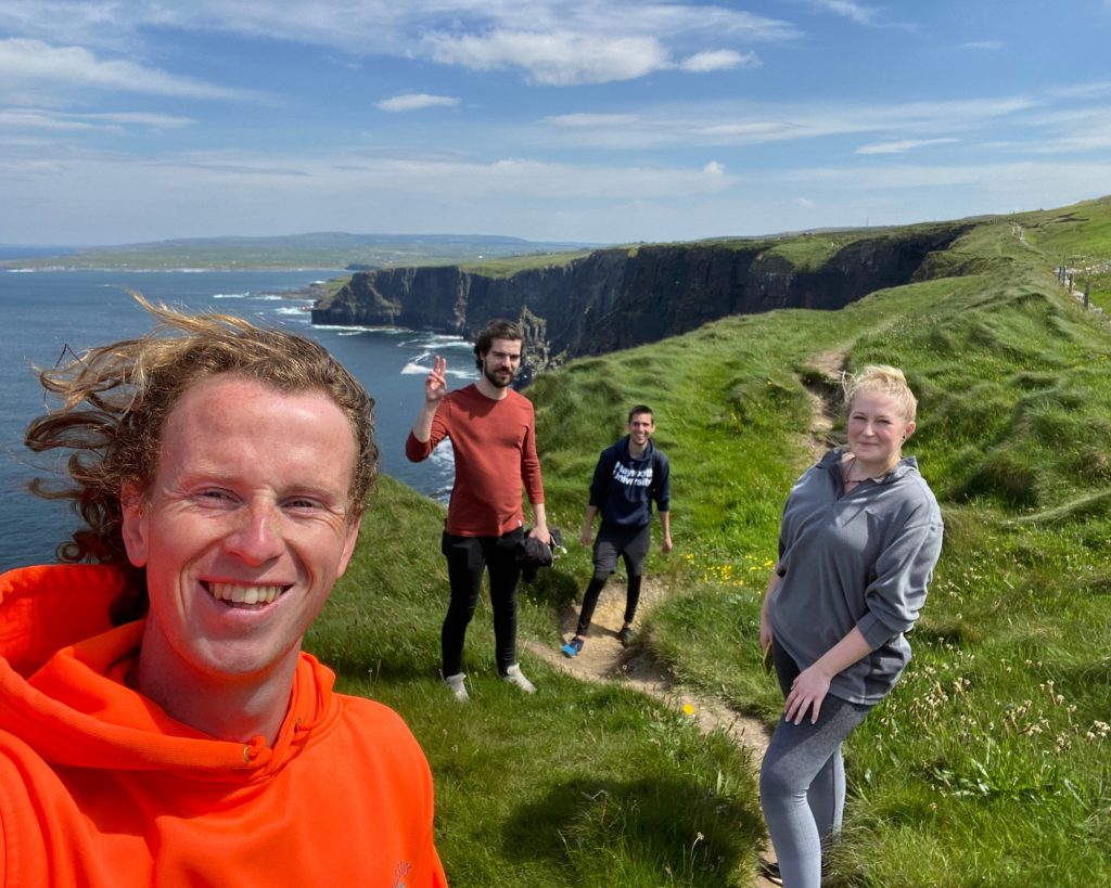 2 Ollie with tourists on a cliff