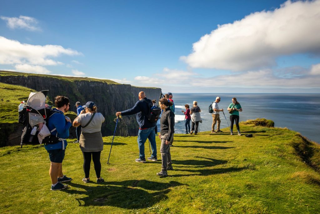AKphoto (148) People enjoying a sunny day with scenic views at the Cliffs of Moher, Ireland.