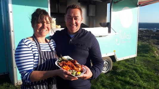 Neven Maguire standing in front of a plate of food