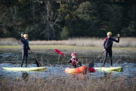 a group of people riding on the back of a boat